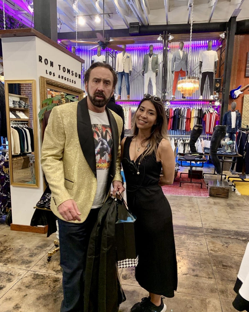 Nicolas Cage in a gold sequin Ron Tomson jacket at the LA flagship