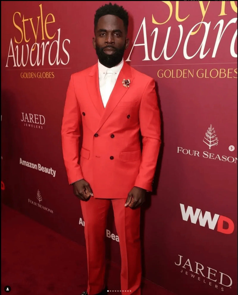 Jimmy Akingbola in a Ron Tomson Super 120S Merino Wool Single Breasted Suit in Blood Orange at the WWD Inaugural Style Awards