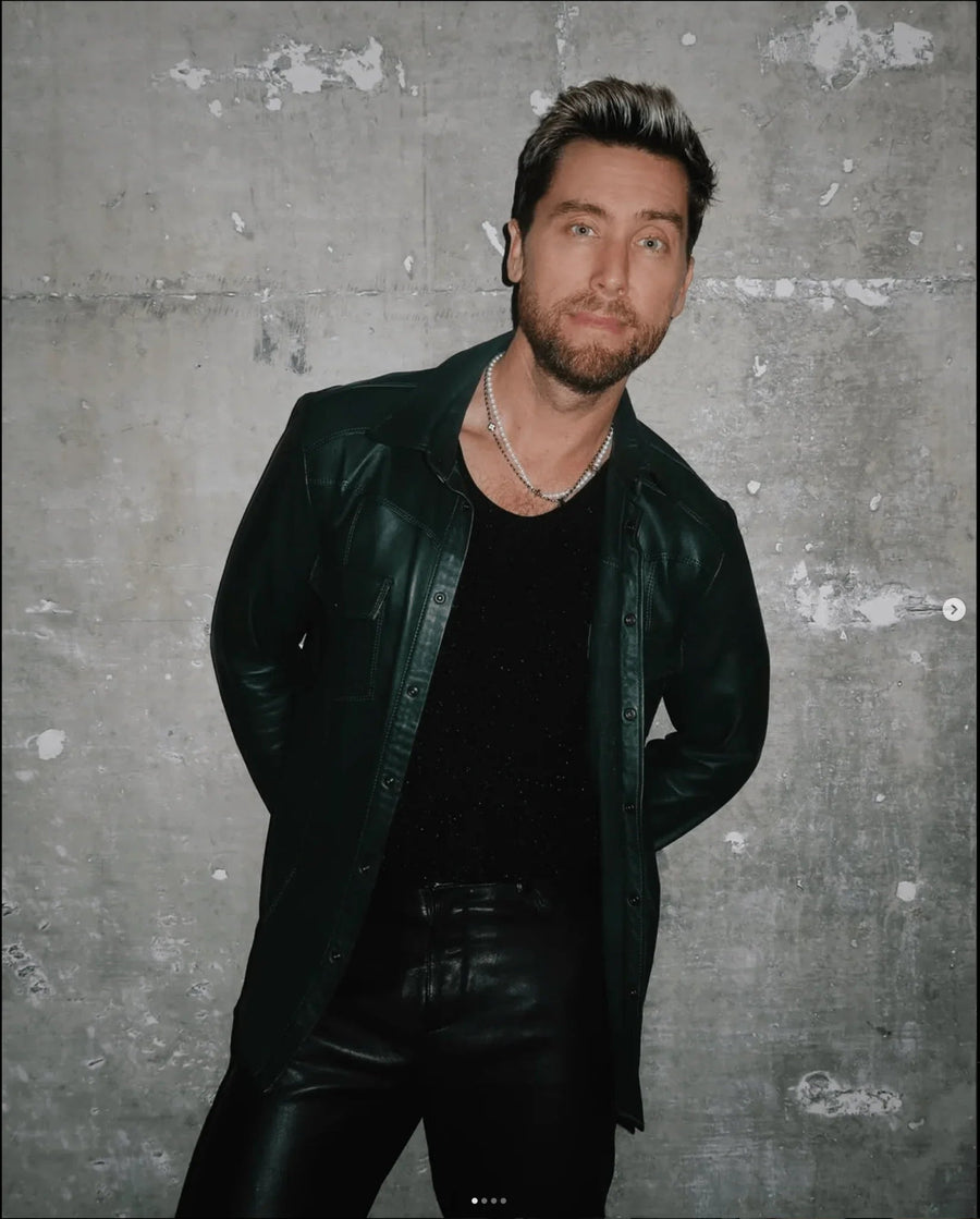 Lance Bass of NSYNC wearing a matching Ron Tomson green lambskin leather shirt and pants
