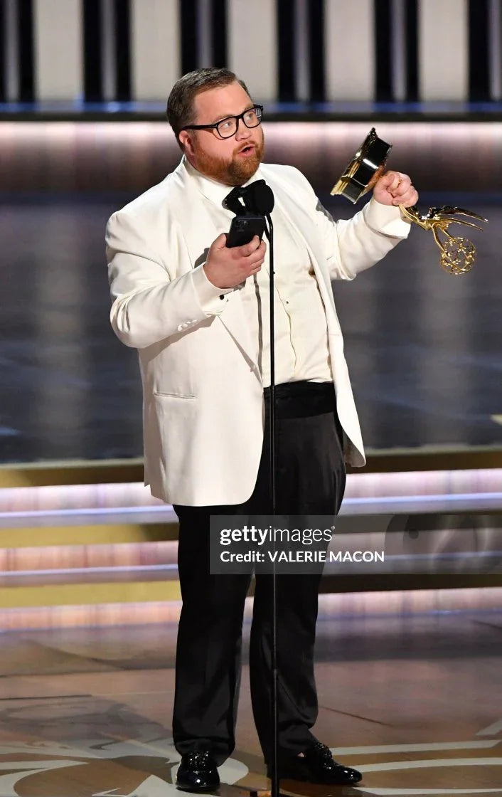 Paul Walter Hauser in a white Ron Tomson shawl lapel tuxedo at the 75th Emmy Awards