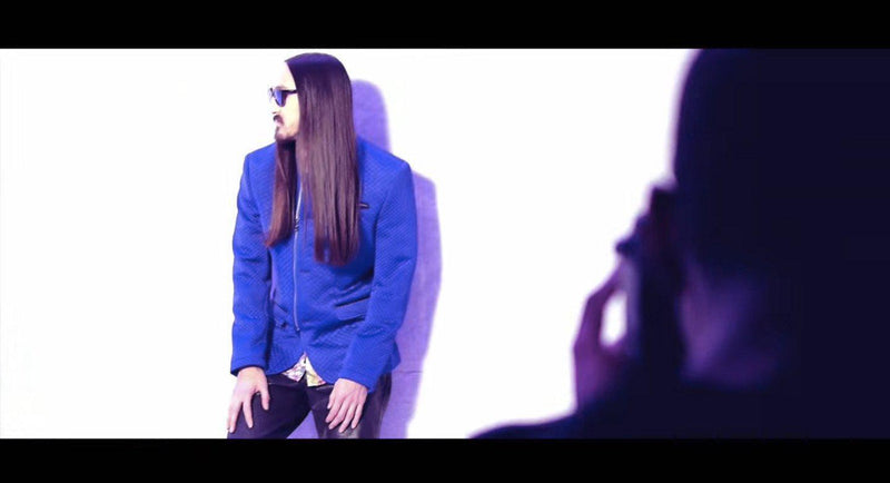 Steve Aoki wearing a Ron Tomson quilted jacket and moto blazer for the 360 Magazine Neon Future photo shoot