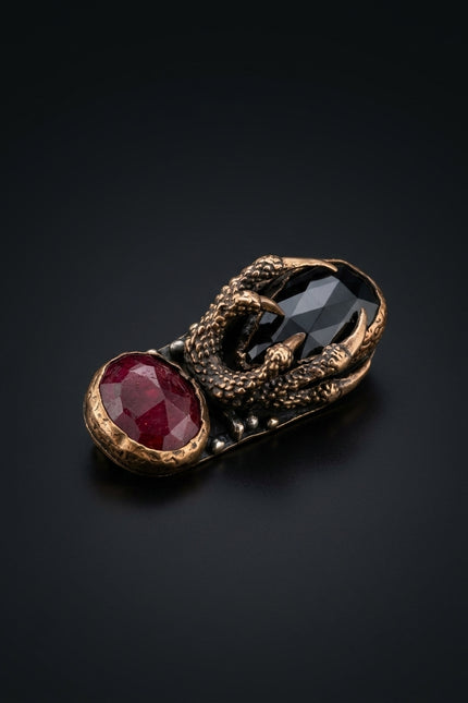 Brooch - Red, Black, Bronze elongated, two stones, claw setting - angle