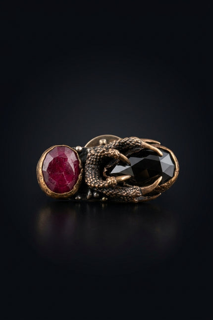 Brooch - Red, Black, Bronze elongated, two stones, claw setting - front