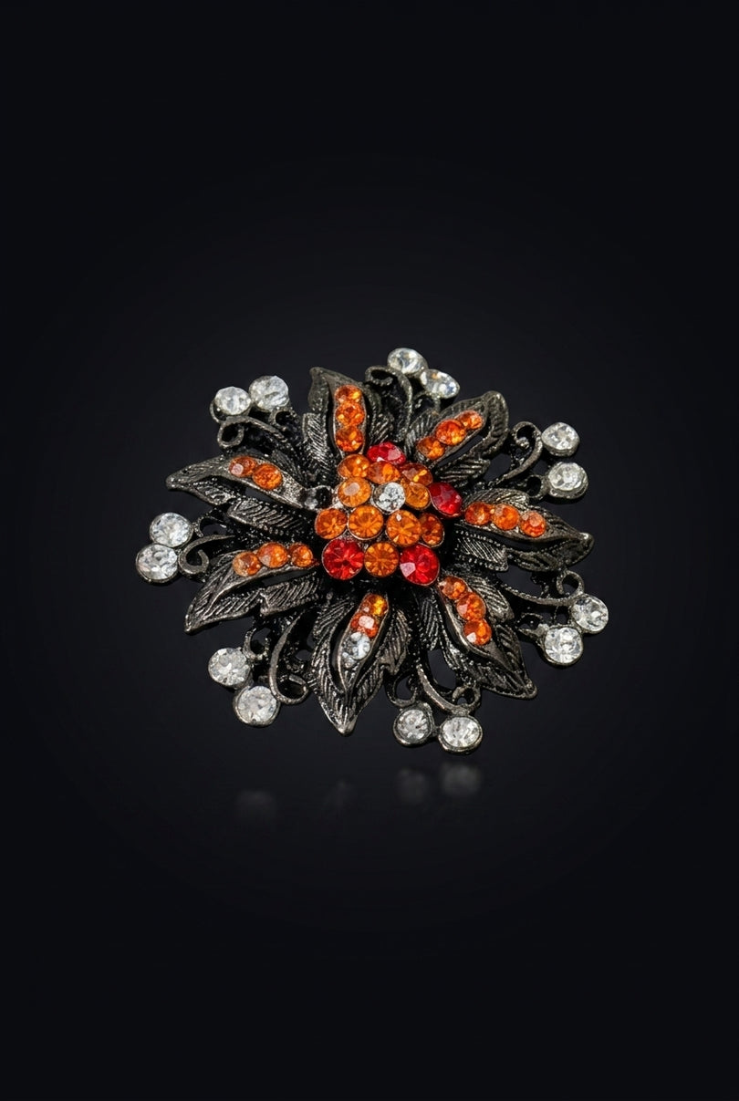 Brooch - Gunmetal Orange Red Clear floral starburst - angle