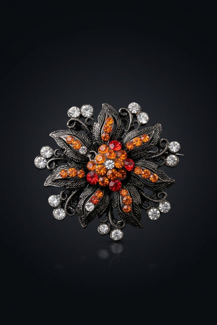 Brooch - Gunmetal Orange Red Clear floral starburst - front