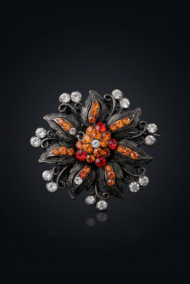 Brooch - Gunmetal Orange Red Clear floral starburst - front