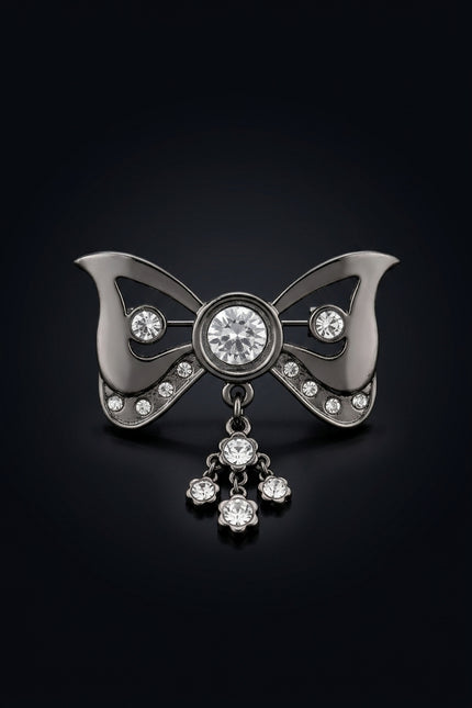 Brooch - Gunmetal bow_with_dangling_flower_charm - front