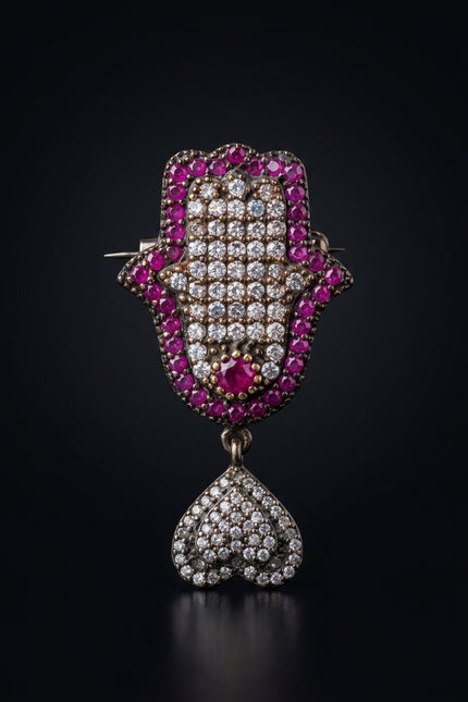 Brooch - Ruby, Crystal, Dark Metal Hamsa hand with dangling cluster - front