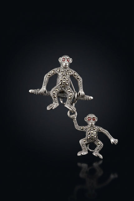 Brooch - Silver two monkey figures, one hanging from the other - front