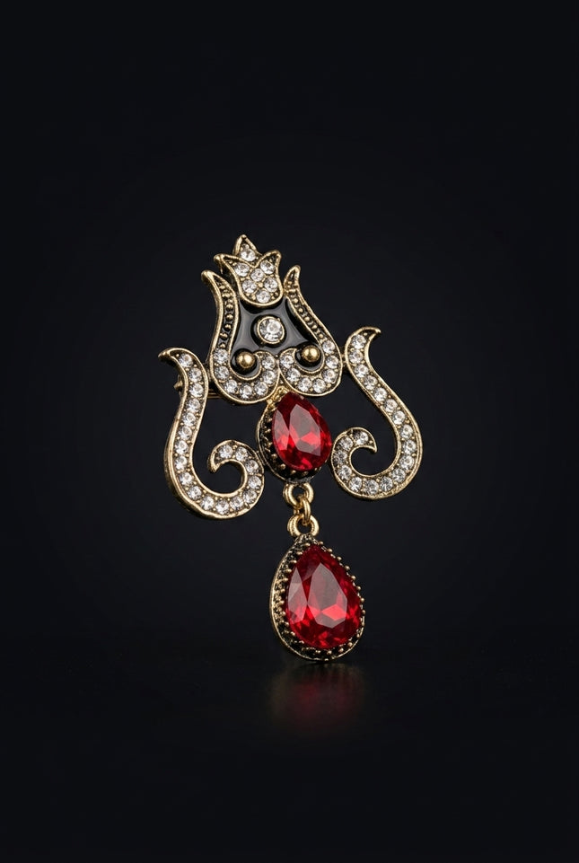 Brooch - Gold, Black, Red, Clear ornate crest with drops - angle