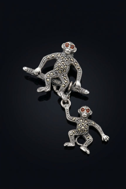 Brooch - Silver, Black, Red two linked monkey figures - angle