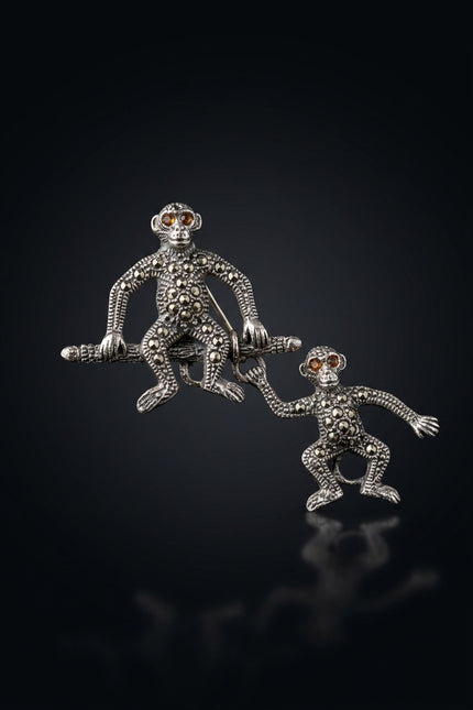 Brooch - Silver, Black, Red two linked monkey figures - front