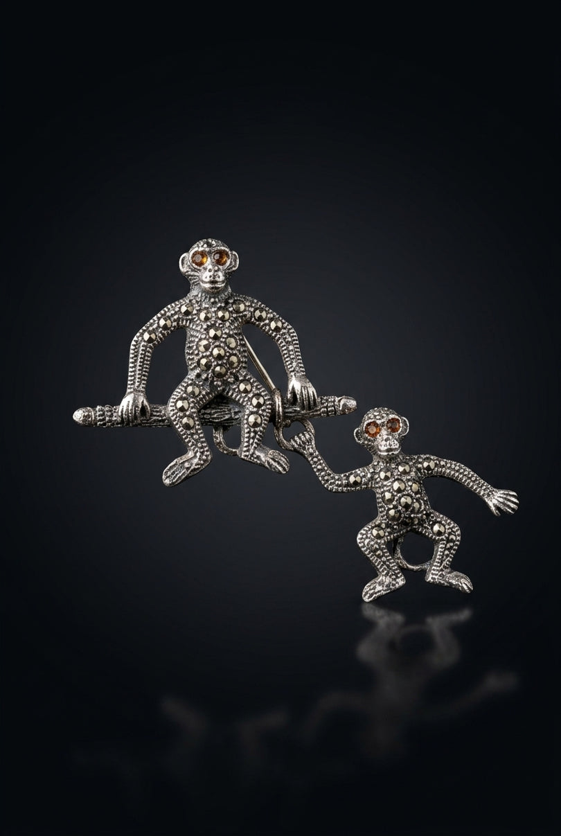 Brooch - Silver, Black, Red two linked monkey figures - front