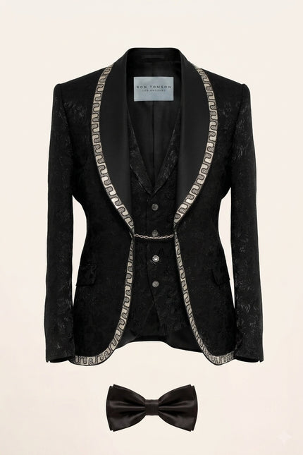 Full view of Ron Tomson Black Baroque Jacquard Mens Tuxedo Suit with silver chain trim lapels, vest, shirt, and bow-tie.