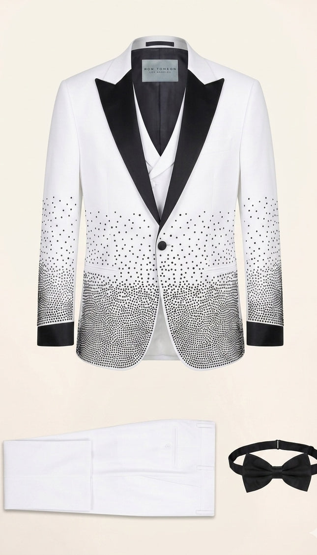 White sequin embellished mens tuxedo suit with black satin shawl lapels and matching pants, vest, and bow tie.