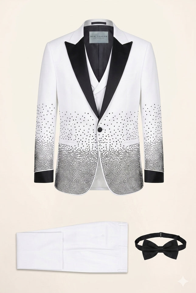 White sequin embellished mens tuxedo suit with black satin shawl lapels and matching pants, vest, and bow tie.