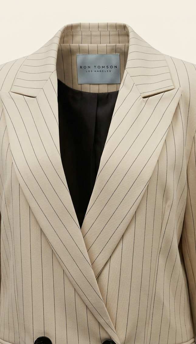 Women's pinstripe peak lapel suit in beige — peak lapel and woven Ron Tomson label detail