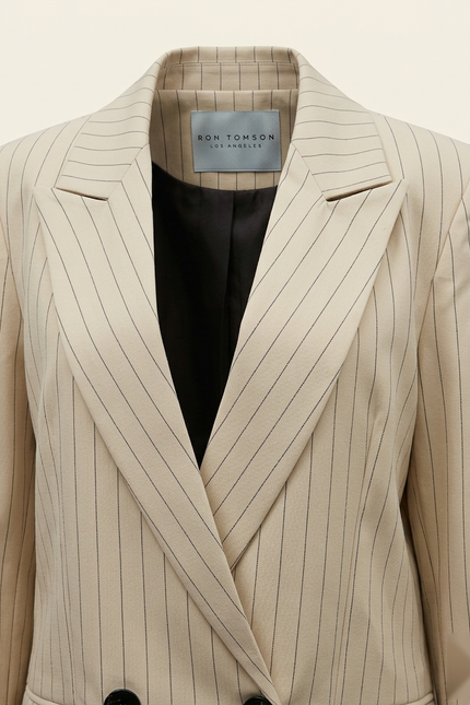 Women's pinstripe peak lapel suit in beige — peak lapel and woven Ron Tomson label detail