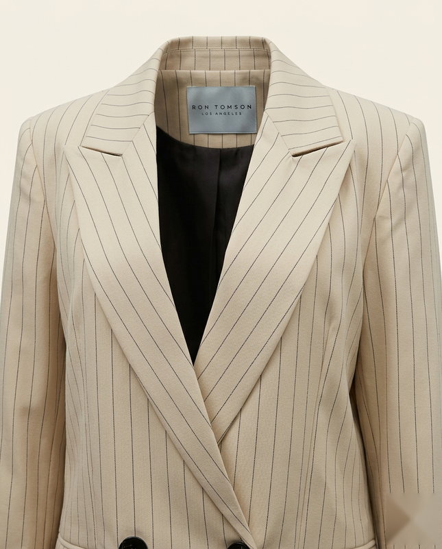 Women's pinstripe peak lapel suit in beige — peak lapel and woven Ron Tomson label detail