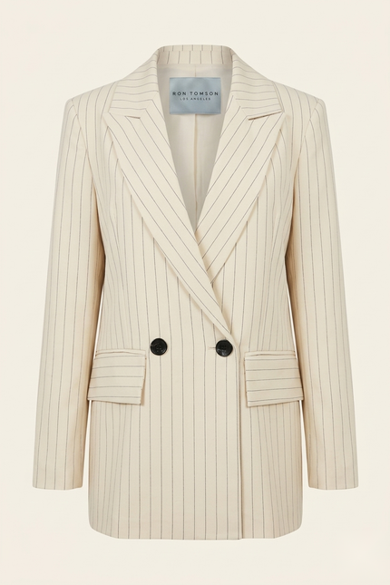 Women's pinstripe peak lapel suit in beige — front view